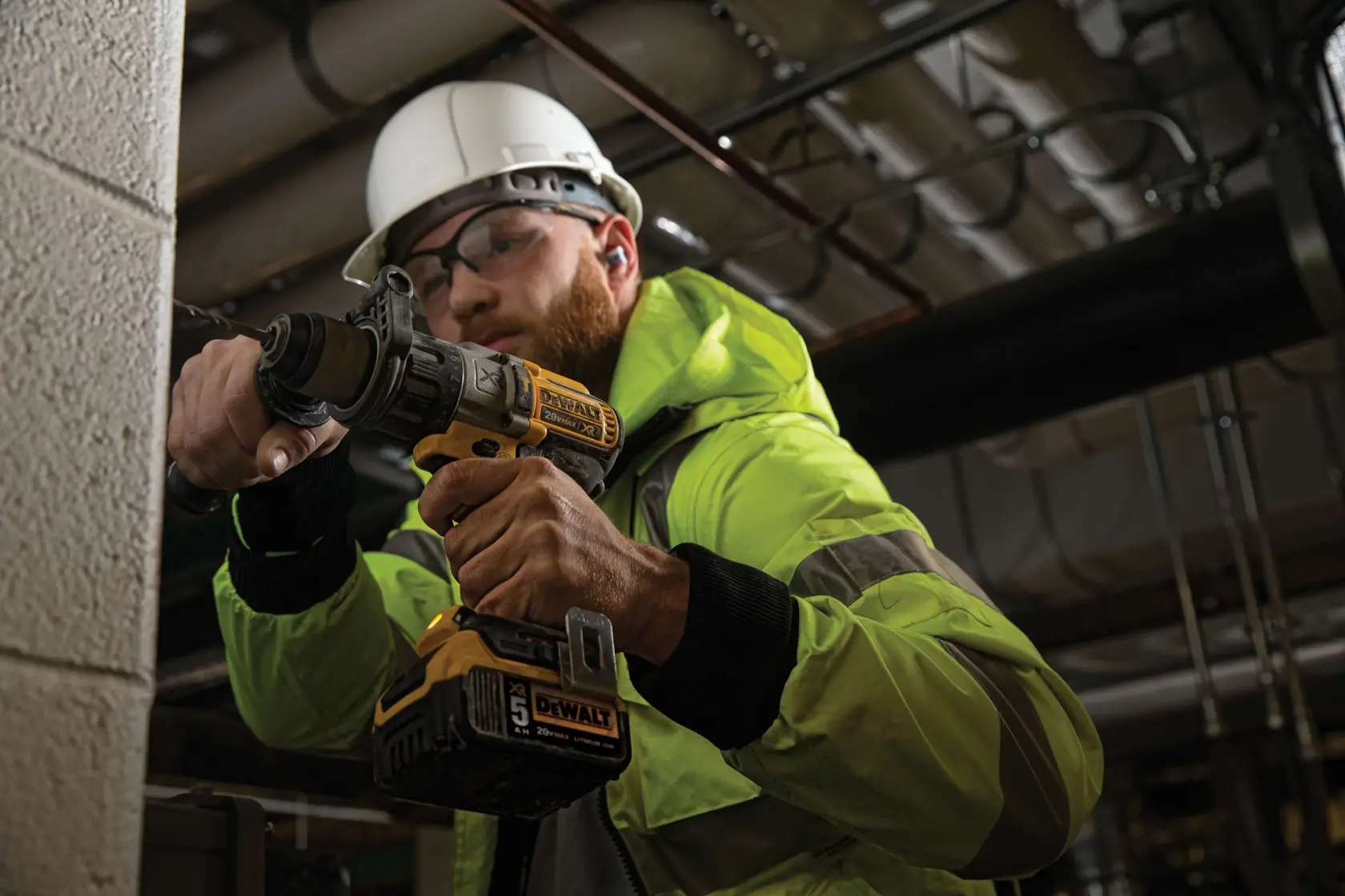 A yellow and black DEWALT cordless power drill with a 20V MAX XR lithium-ion battery, featuring a comfortable grip and compact design.