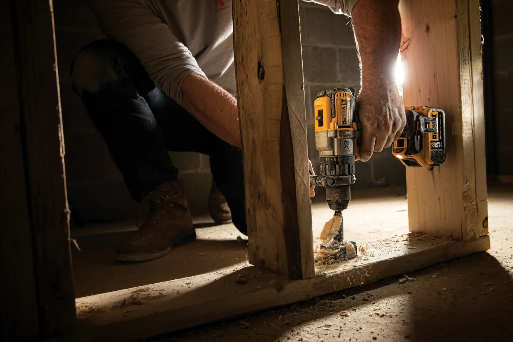 A DeWalt DCD996P2 20V Max XR cordless power drill with a side handle, yellow and black design, 5Ah lithium-ion battery, and branding labels visible.